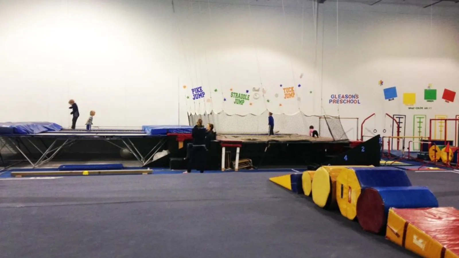 Preschoolers jumping into foam pits at Gleason’s Gymnastics