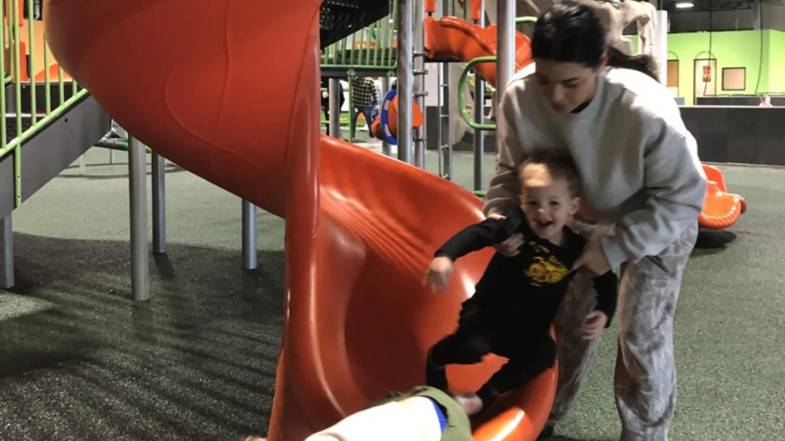 Families jumping on the inflatable pillow at Good Times Park