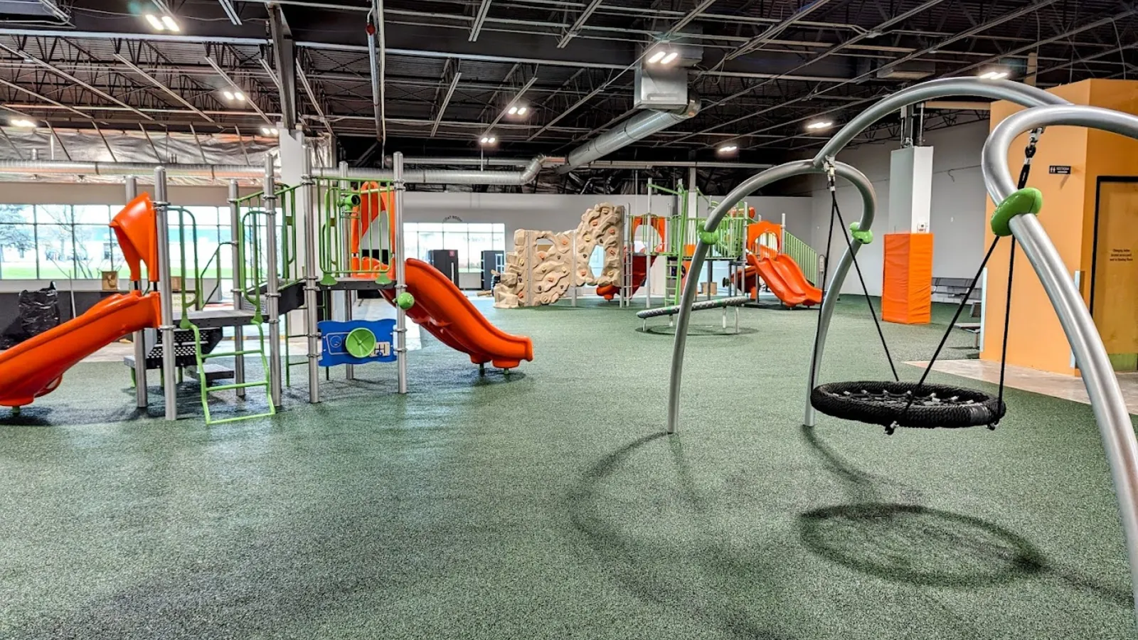 Kids running on the turf at Good Times Park Woodbury