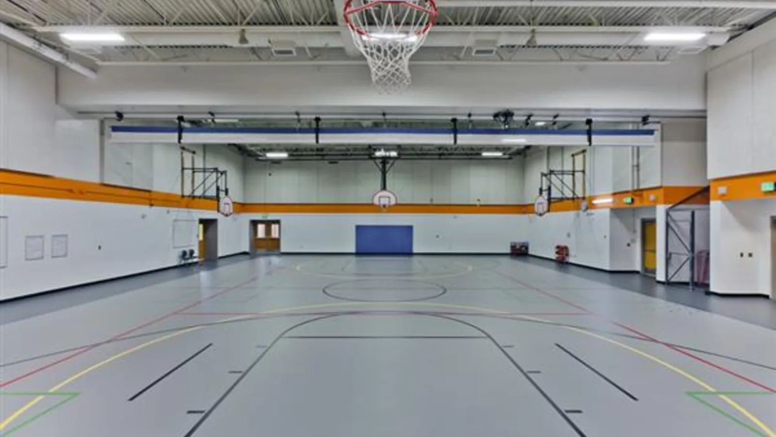 Toddlers playing with soft blocks in a small gym