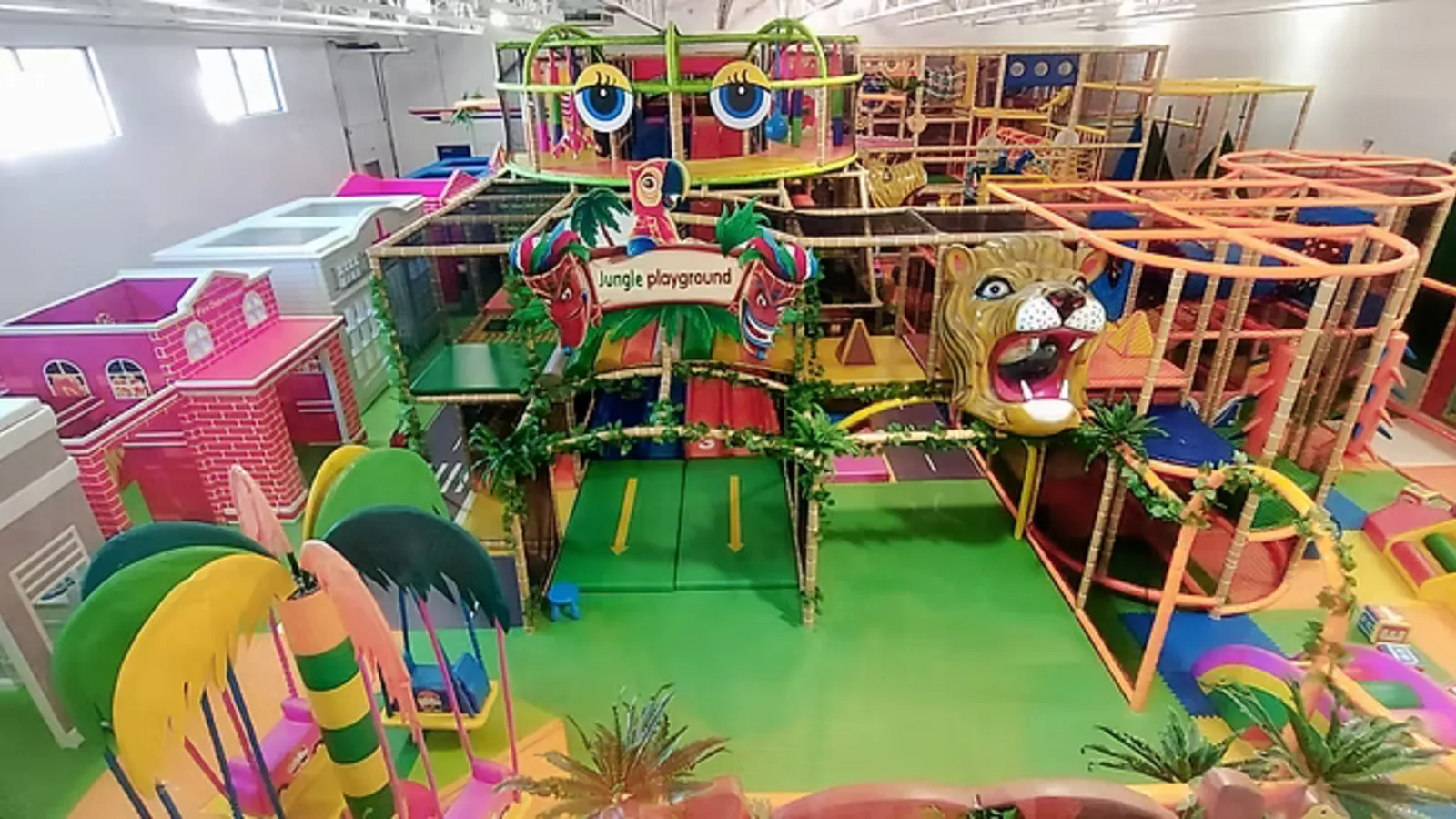 Kids playing on multi-level climber at Hudson’s Jungle Gym