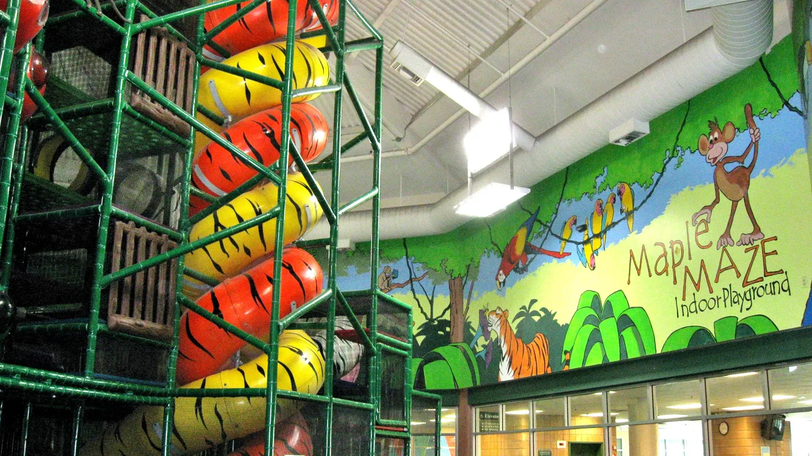 Kids climbing inside Maple Maze Indoor Playground
