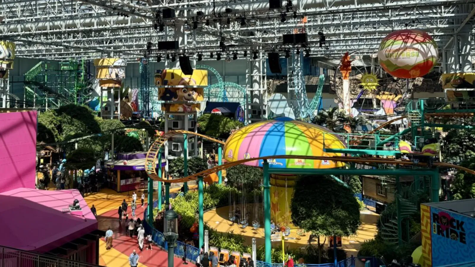 Families riding a roller coaster at Nickelodeon Universe