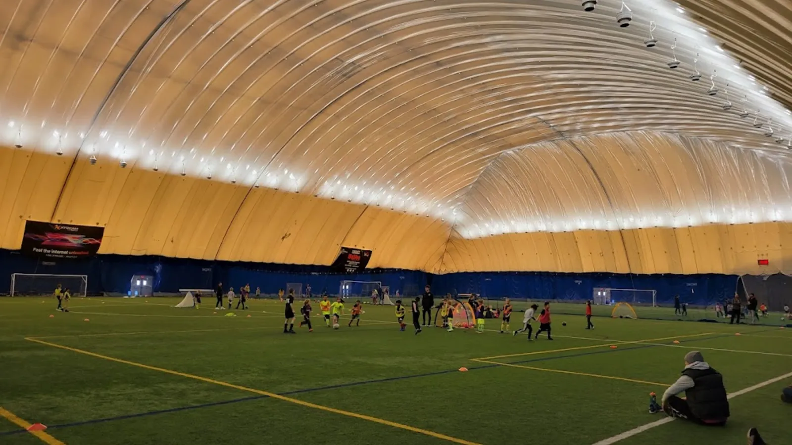 Kids playing in the Savage Sports Center dome