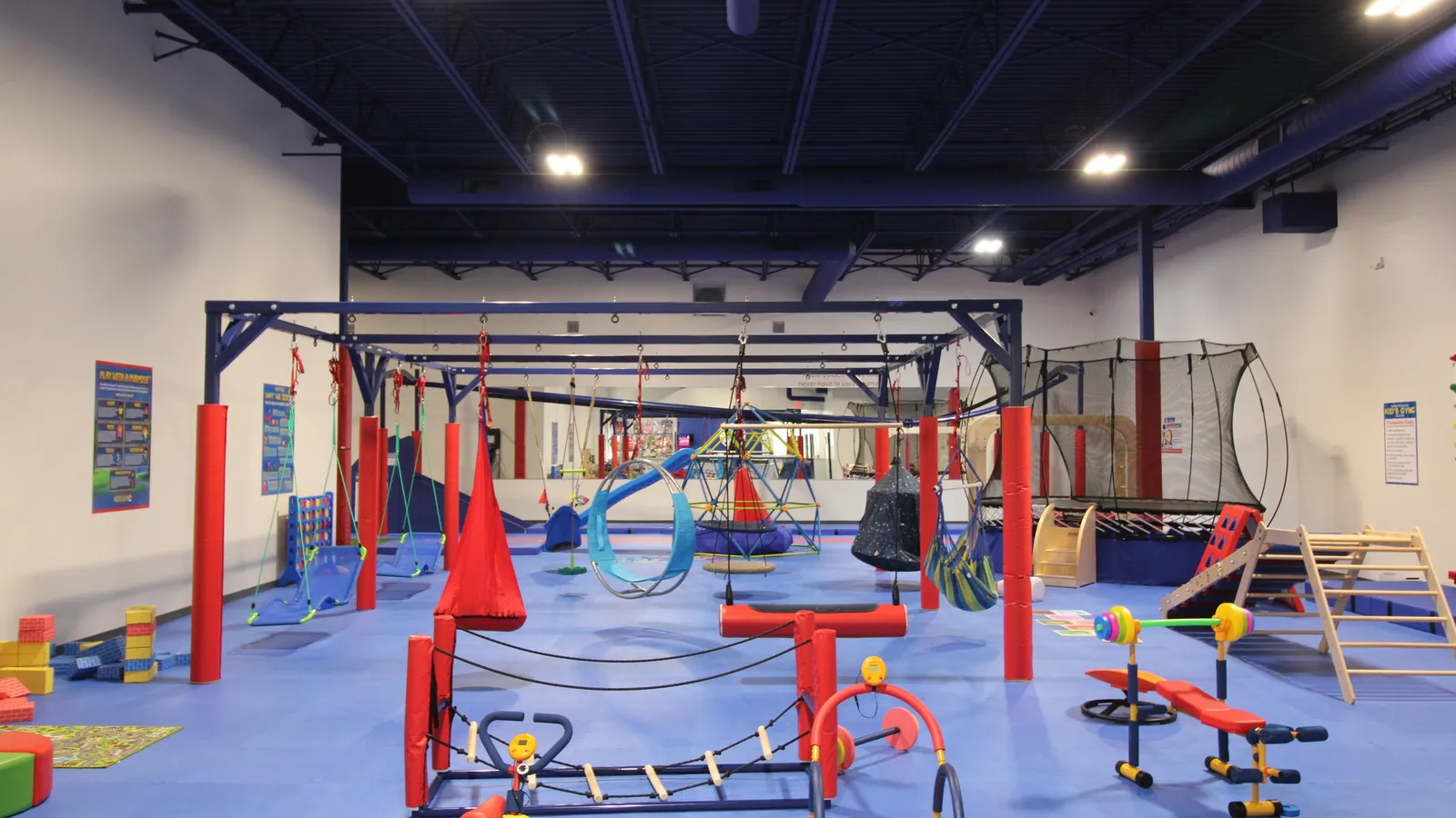 Children using sensory swings at We Rock the Spectrum